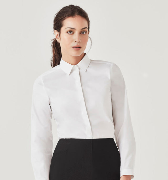 Woman wearing a crisp white long sleeve business shirt tucked into a black skirt – ideal for custom branded corporate uniforms, hospitality staff wear, and professional office attire in Australia.