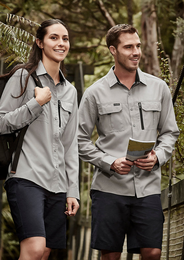 Man and woman walking outdoors in custom grey long-sleeve work shirts and navy shorts – ideal for custom branded work shirts with no minimum order, designed for tradies and outdoor teams in Australia.