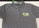 Dark grey polo shirt featuring the iGreenData logo embroidered on the chest in white and green, displayed flat with a green swing tag attached.