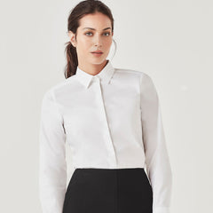 Woman wearing a crisp white long sleeve business shirt tucked into a black skirt – ideal for custom branded corporate uniforms, hospitality staff wear, and professional office attire in Australia.