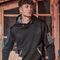 Young tradesman wearing black work hoodie with utility pocket – custom printed jumper with free logo included, ideal for construction and job sites.
