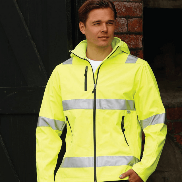 **Alt Text:** Male worker wearing high visibility yellow safety jacket with reflective tape – custom printed hi-vis outerwear with free logo included, compliant with AS/NZS standards.