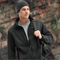 **Alt Text:** Man wearing black softshell work jacket and beanie outdoors – custom printed jacket with free logo included, perfect for staff uniforms and winter workwear.