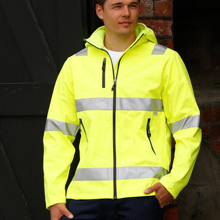 Man wearing a high-visibility yellow softshell work jacket with reflective tape, includes free printed logo – My Uniform Shop